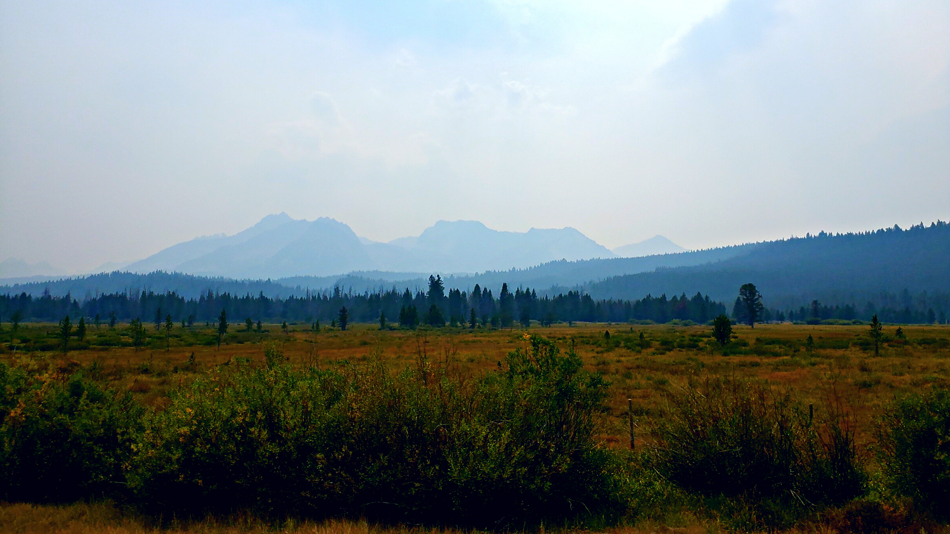 The mountains outside of Stanley, ID are hazy from recent wildfires.