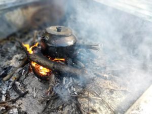 Kaffepanna making coffee over an open fire. Soon it will be Fika time!