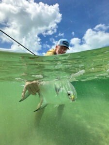angler releases permit back into the water - Ascension Bay, Mexico