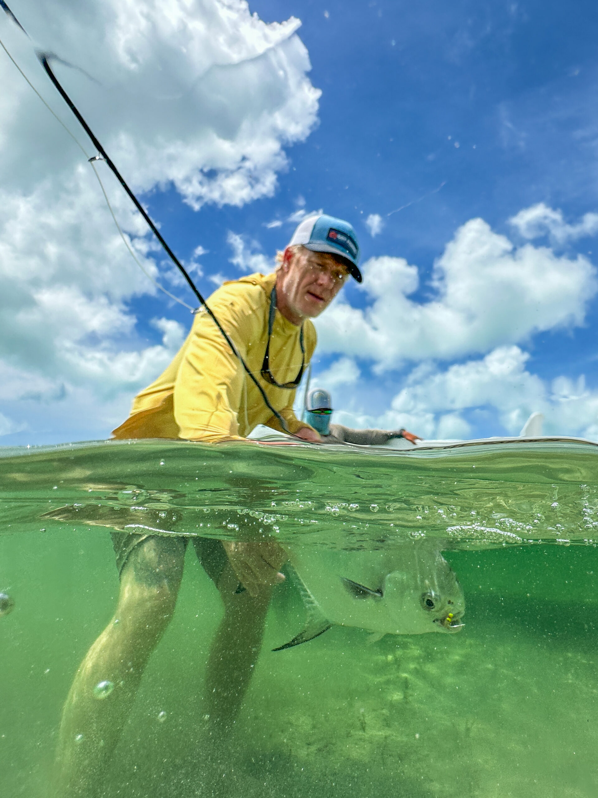 angler releases a permit in Ascension Bay, Mexico