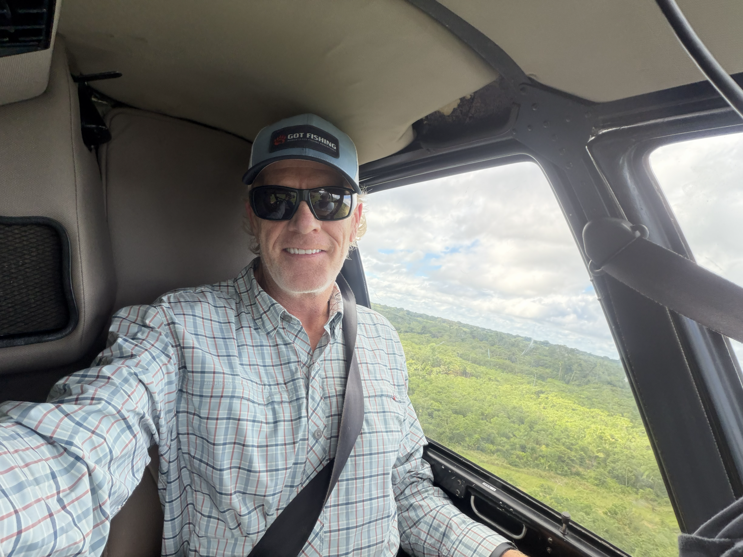 Brian flying into the Amazon jungle in a helicopter
